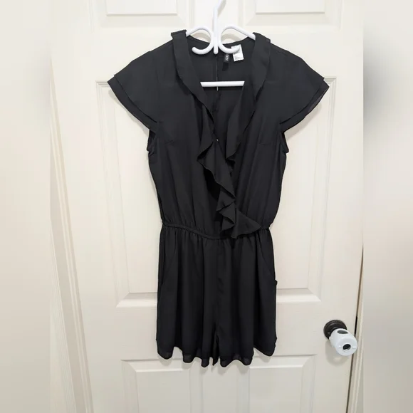 Black Ruffled Short Sleeve Romper - Picture 1 of 3